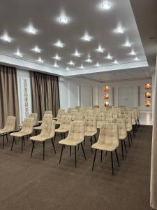 a large room with rows of chairs and tables at TAMYRLY Astana in Astana