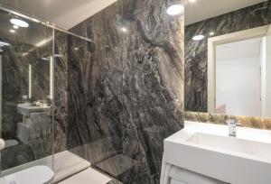 a bathroom with a sink and a shower at Porto River in Porto +165 photos