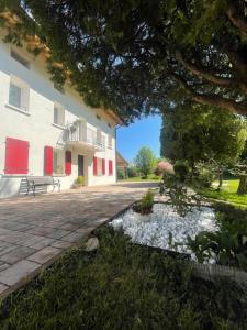 a courtyard of a building with a pond at Casa Riva Us in Dussoi