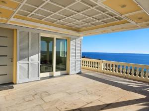 an outdoor patio with a view of the ocean at Mare e Relax - La Villetta ai Tre Ponti - Trilocale in Sanremo