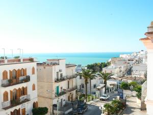 an aerial view of a city with buildings and the ocean at Hotel Timiama in Peschici