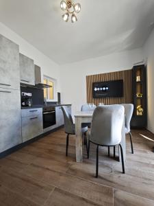 a dining room with a table and chairs at 119 Bliss Apartment in Sliema