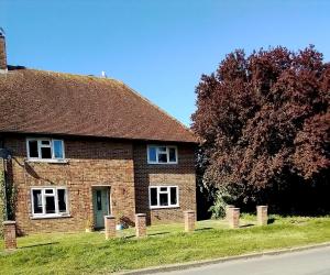 a brick house on the side of a street at Large double room with spacious ensuite in Southbourne