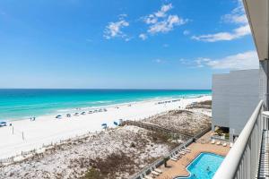 a view of the beach from the balcony of a condo at Spacious gulf front condo with beach access in Fort Walton Beach