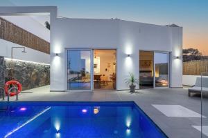 a house with a swimming pool in the yard at villa yasmin luxury in Bali