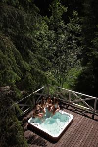 a group of children sitting in a hot tub at Маєток Ліс і Гори in Bukovel