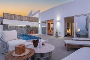 a villa with a pool and a living room at villa yasmin luxury in Bali +48 photos