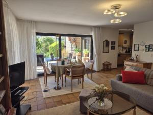 a living room with a table and a couch at Fewo Amber in Heimbach