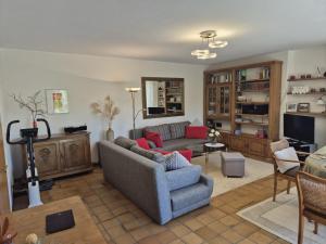 a living room with a couch and a chair at Fewo Amber in Heimbach