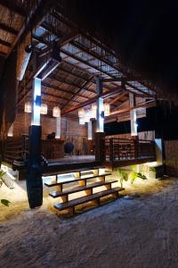 a large room with a group of tables and lights at Tigbaw in Mactan +5 photos