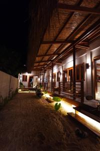 a building at night with the lights on at Tigbaw in Mactan