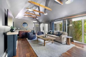 a living room with a couch and a table at KPT Salt Pine House Apartment in Kennebunkport