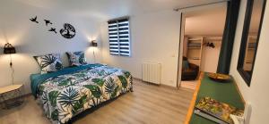a bedroom with a bed and a table and a window at Loveroom in Lavoux