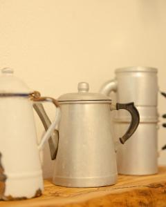a group of three coffee pots sitting on a table at Agriturismo Alveare in Finale Ligure