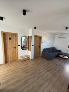 a living room with a couch and a table at Apartma Luvita in Golnik