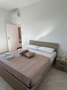 a bed with two pillows on it in a bedroom at Casa Vacanze Anema & Core in Agerola