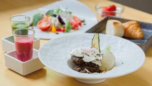 a table with two plates of food and a drink at 奈良春日 鹿のや in Nara +111 photos