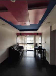 a living room with a couch and a table at Casa Cristian in Caracas