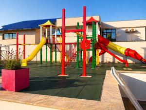 a playground with a slide in front of a building at HF - Mamaia Nord in Mamaia Sat/Năvodari