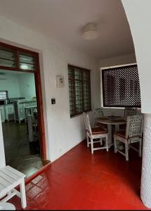 a dining room with a table and chairs at Studio Leliya in Malindi