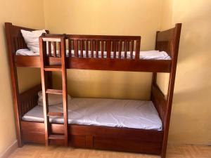 a couple of bunk beds in a room at Zebra guesthouse Hawassa in Āwasa
