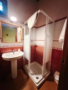 a bathroom with a shower and a sink at Casa Puerta de Albarracín in Albarracín +7 photos