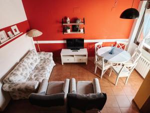 a living room with a couch and a table at Casa Puerta de Albarracín in Albarracín