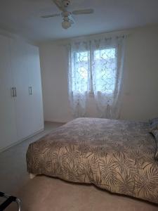 a bedroom with a bed and a window at B&B Montegrappa in Mestrino