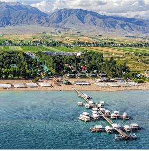 an aerial view of a marina with boats in the water at Радуга in Chon-Sary-Oy