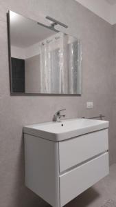 a bathroom with a white sink and a mirror at B&B Montegrappa in Mestrino +20 photos