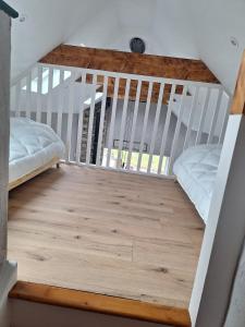a bedroom with a bunk bed and a staircase at Sunny Hills Cottage in Cornamona