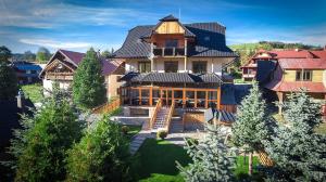 an aerial view of a large house with a roof at Apartmany U Jezka in Ždiar