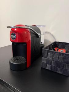 a red toaster sitting on top of a counter at Da Caterina Appartamento Con Cucina in Cittadella