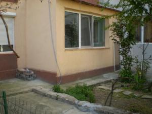 a house with a blue hose coming out of it at apartament MIHAI in Mangalia