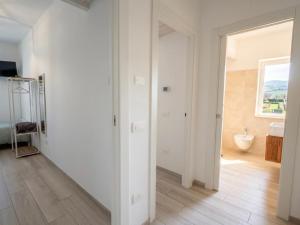 a white room with a bathroom with a sink at b&b Il Margonico in Potenza