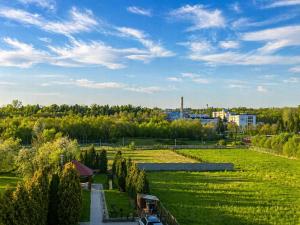 a view of a park with trees and a road at Willa Fenix Busko-Zdroj Pokoje Goscinne & Agroturystyka in Busko-Zdrój