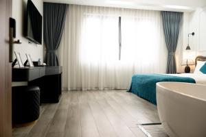 a bedroom with a bed and a large window at HC Homestay Ocean Park 23 in Cửu Cảo +20 photos