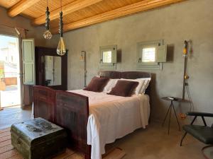 a bedroom with a large bed in a room at Papalei La Maison in Ragusa