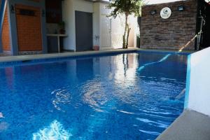 a swimming pool with blue water in a house at Casa Completa in Rancho San Pedro +17 photos