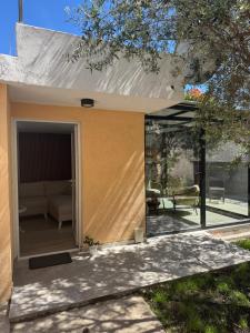 a living area of a house with a patio at Mille in Igalo
