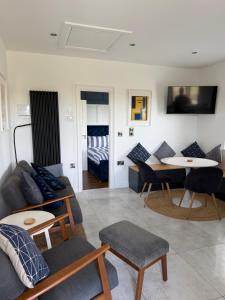 a living room with a couch and a table at Sperrin View in Omagh