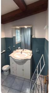 a bathroom with a sink and a toilet at Le cabanon in Valensole