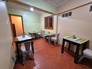a group of tables and chairs in a room at La Valentina in Purmamarca +44 photos