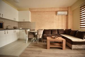 a living room with a couch and a table at Apartman Valentina Aqua Park in Jagodina