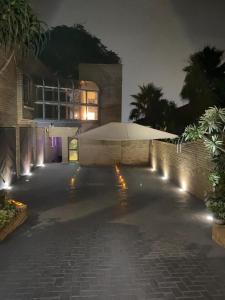 a driveway of a house at night with lights at The View on Nyle Rustenburg in Rustenburg