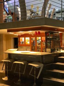 a bar in a building with stools around it at The View on Nyle Rustenburg in Rustenburg