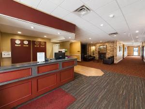a lobby of a hotel with a reception desk at Ace Inn in Fort McMurray