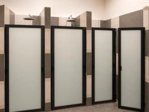 a row of four mirrors in a room at Morada Luna Centro Histórico in Mexico City