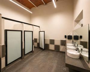 a bathroom with three sinks and three mirrors at Morada Luna Centro Histórico in Mexico City +44 photos