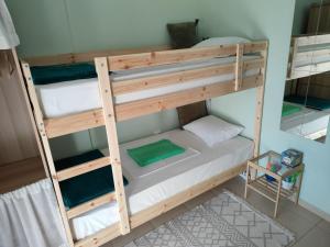 a bedroom with two bunk beds in a room at SiviriLovelyApartment in Siviri